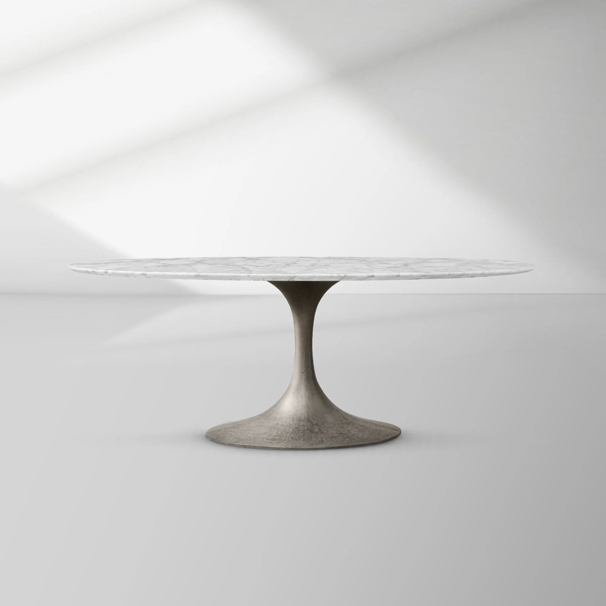 Aero Oval Stone Dining Table with Marble Top and Cast Steel Pedestal Base