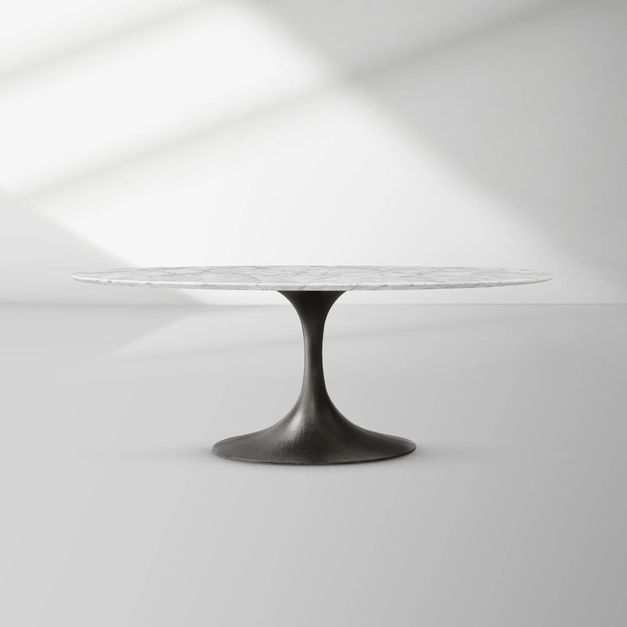 Aero Oval Stone Dining Table with Marble Top and Cast Steel Pedestal Base